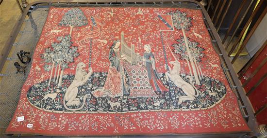 Hines of Oxford. A machine made tapestry - Lion and unicorn, with figures weaving, together with a wrought iron pole, H.128cm, W154cm